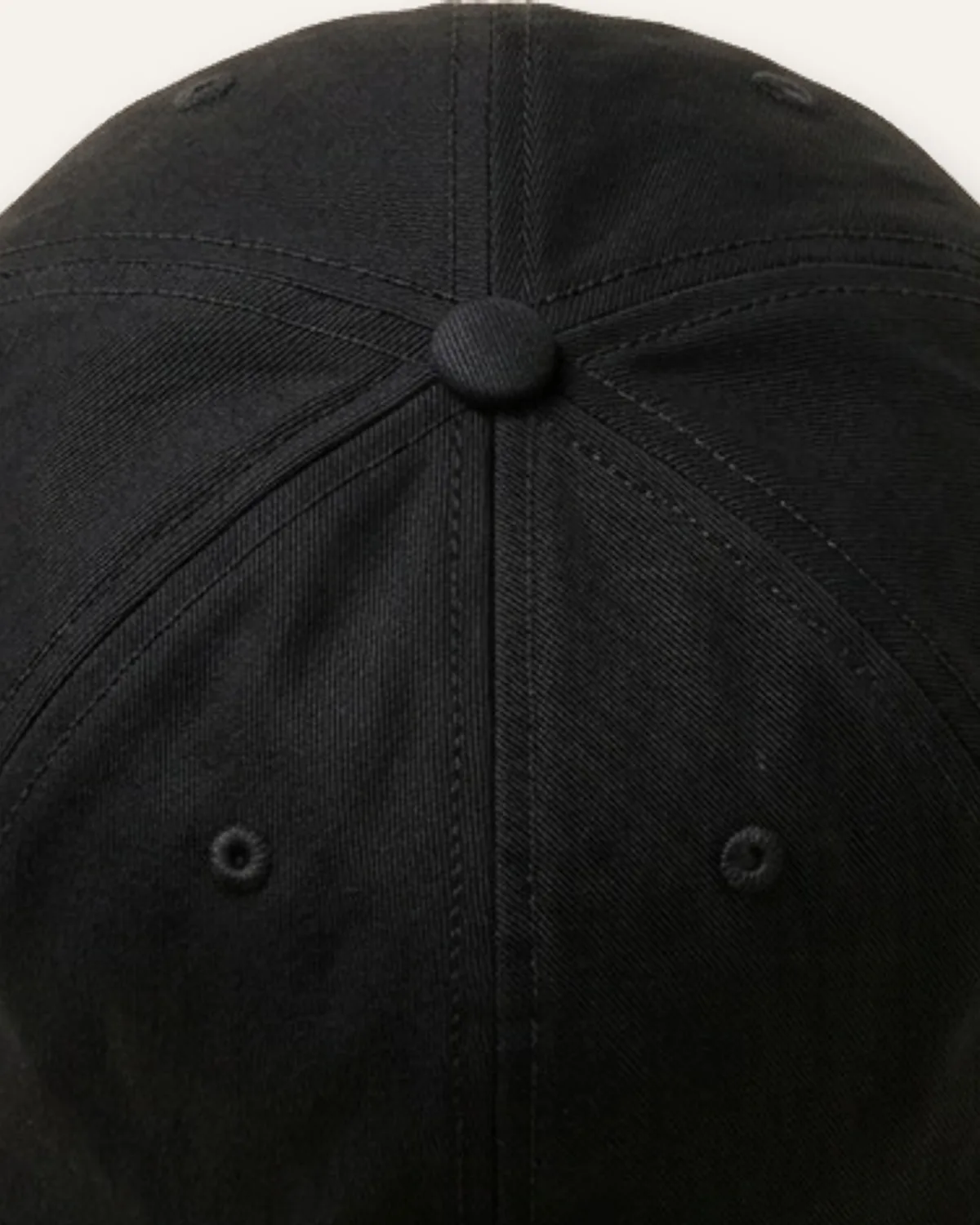 Unstructured Dad Cap in Black, laid flat, detail